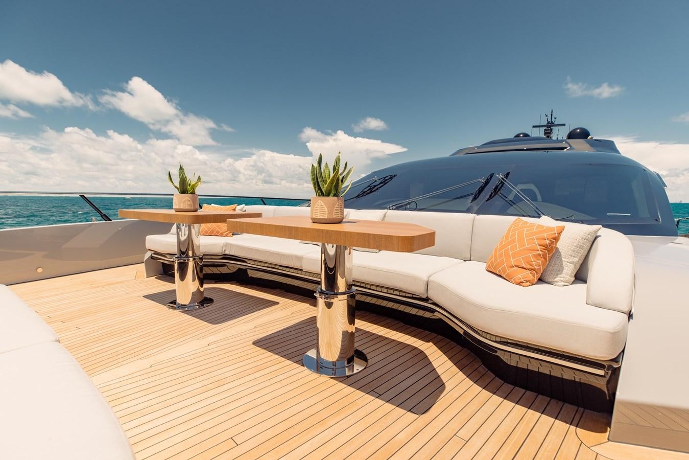 a white boat on a deck aboard OFFLINE Yacht for Sale