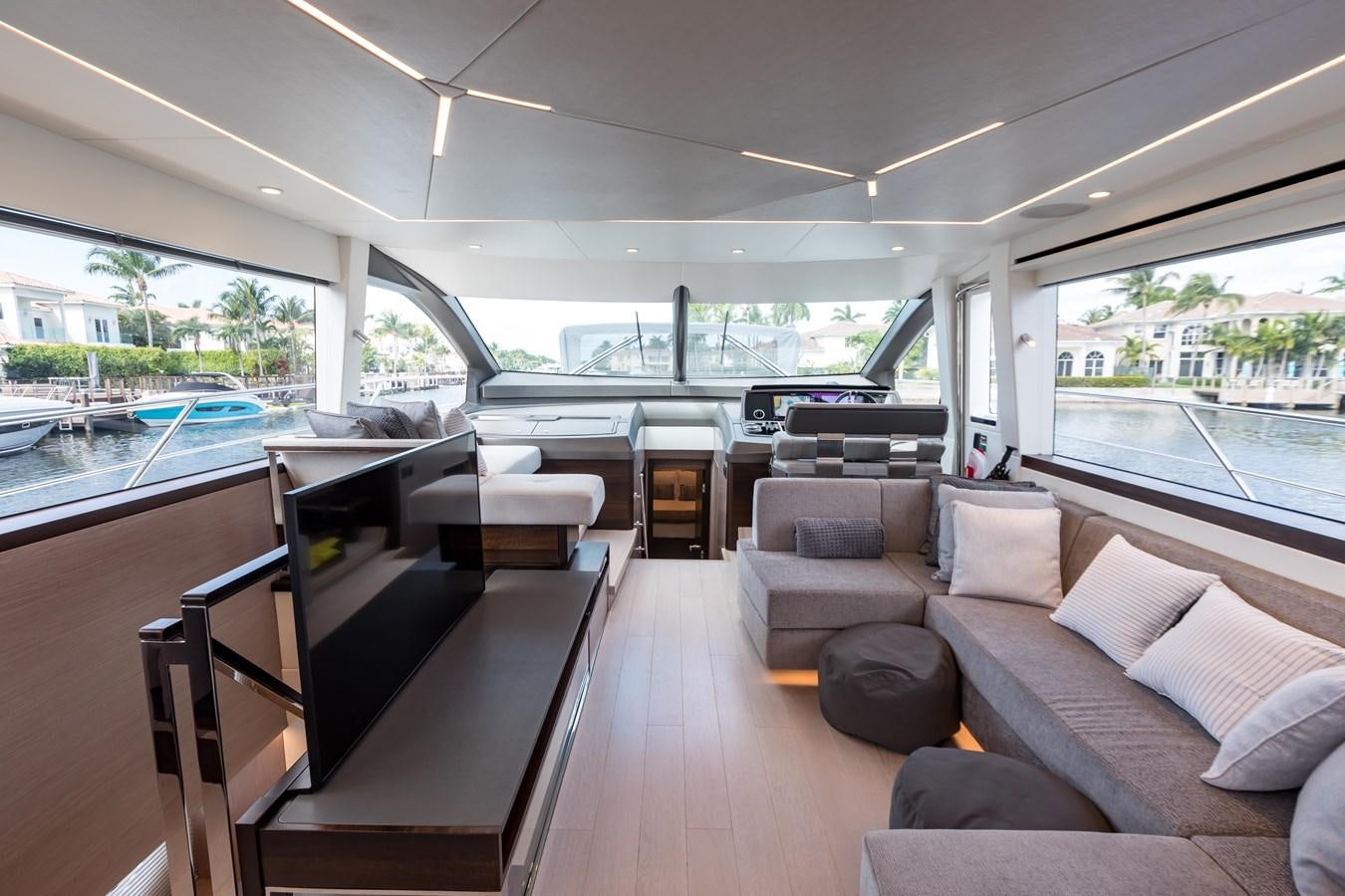inside of a vehicle with a large window and a view of the water aboard NAVAL Yacht for Sale