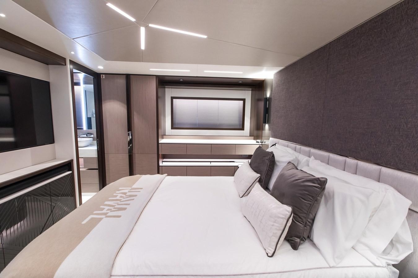 a bed in a room aboard NAVAL Yacht for Sale