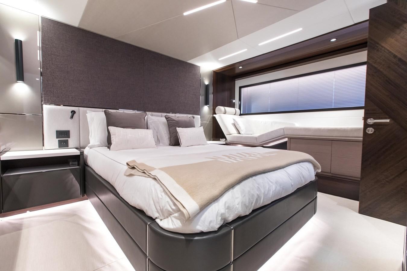 a room with a bed and a tv aboard NAVAL Yacht for Sale