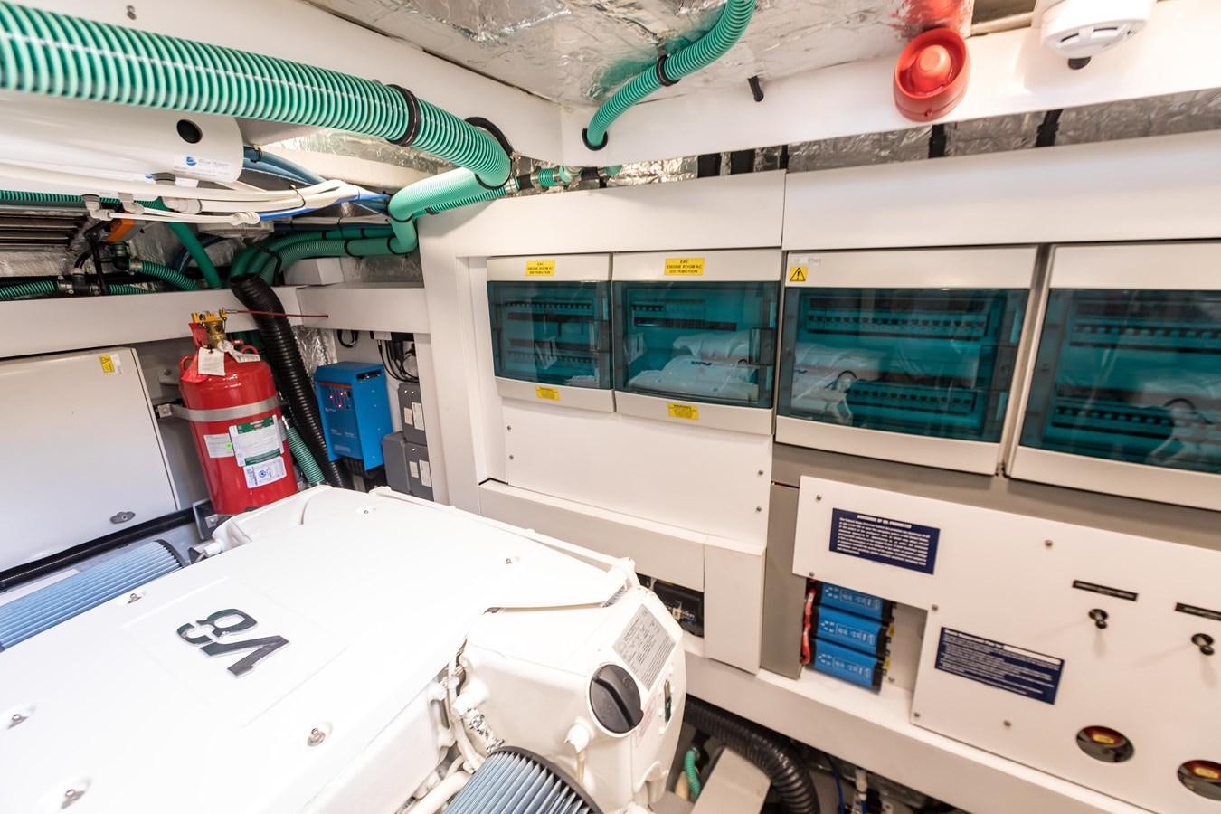 a room with a white table and a white table and a white table aboard NAVAL Yacht for Sale