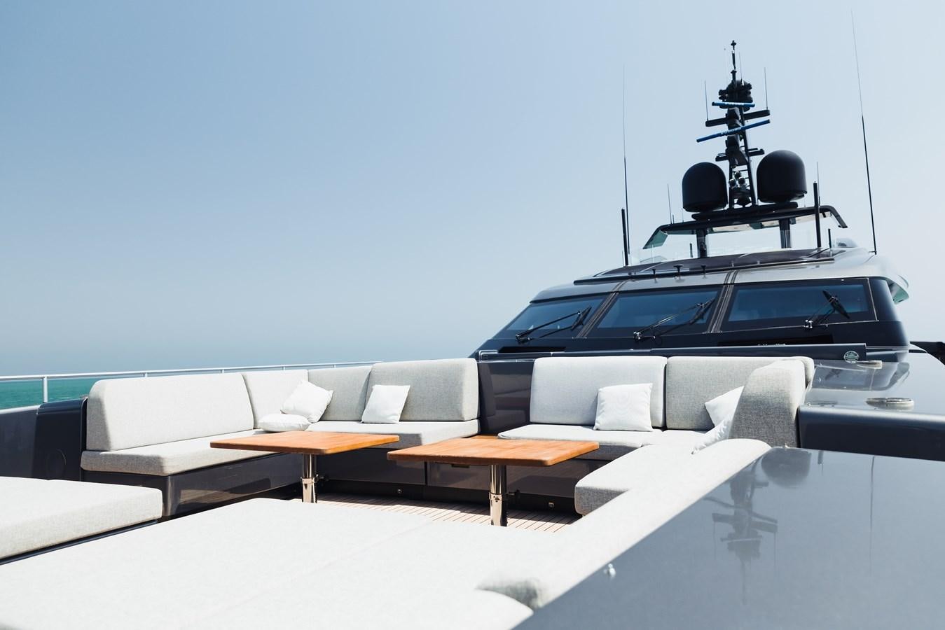 a black car on a white surface aboard LUCKY ME Yacht for Sale