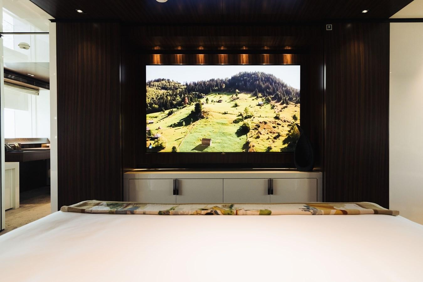 a tv on a stand aboard LUCKY ME Yacht for Sale