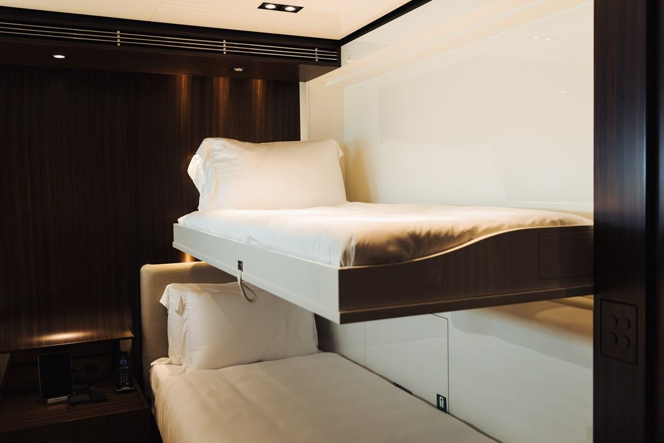 a bed with white sheets aboard LUCKY ME Yacht for Sale