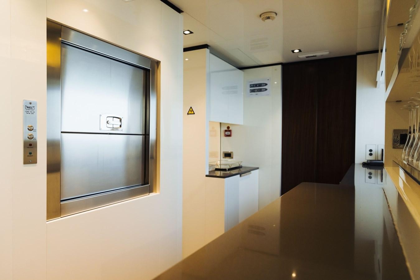 a room with a counter and cabinets aboard LUCKY ME Yacht for Sale