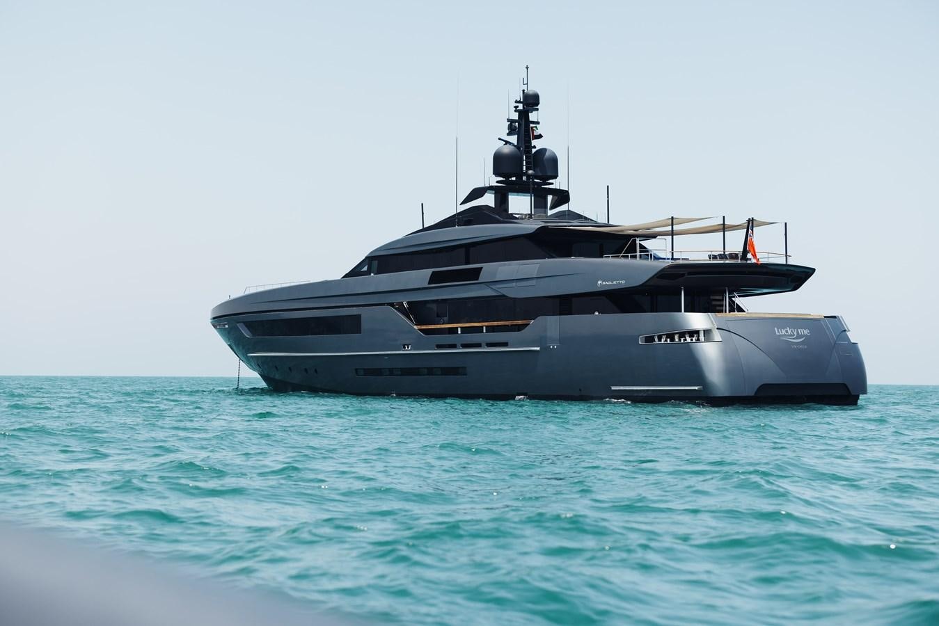 a large ship in the water aboard LUCKY ME Yacht for Sale