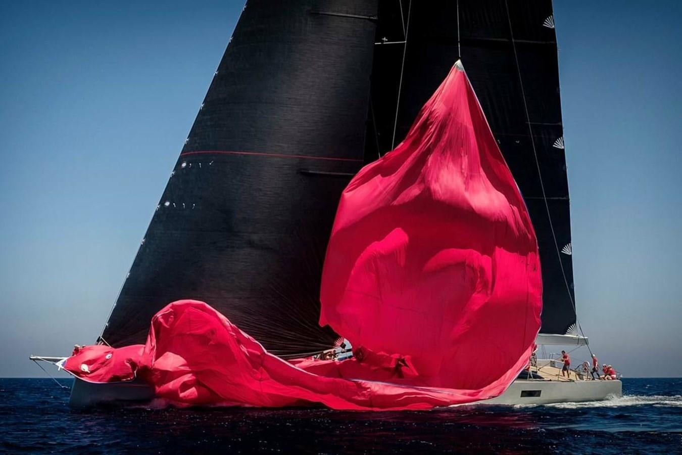 a large red sailboat aboard RIBELLE Yacht for Sale