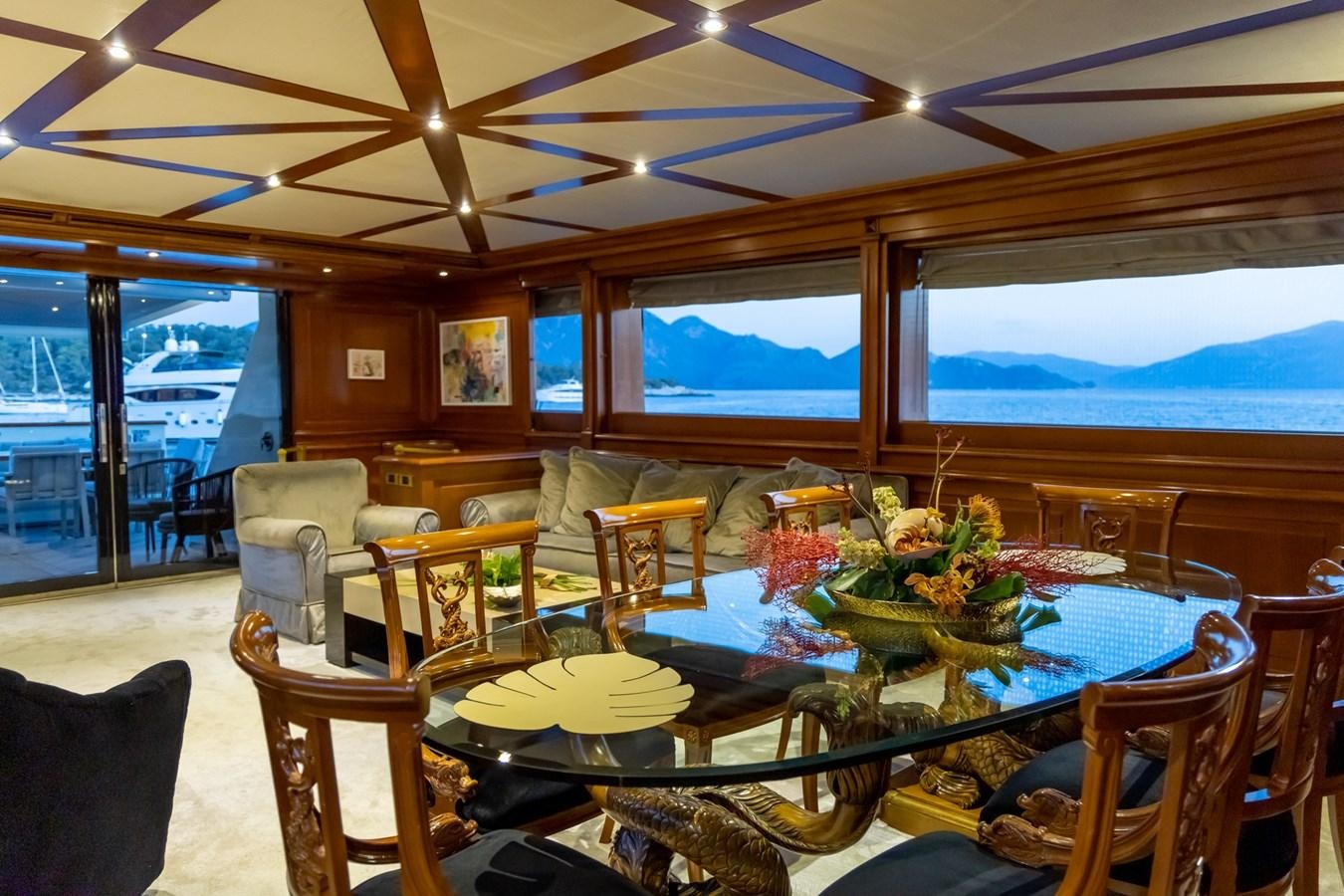 a dining room with a table and chairs aboard AQUILLA Yacht for Sale