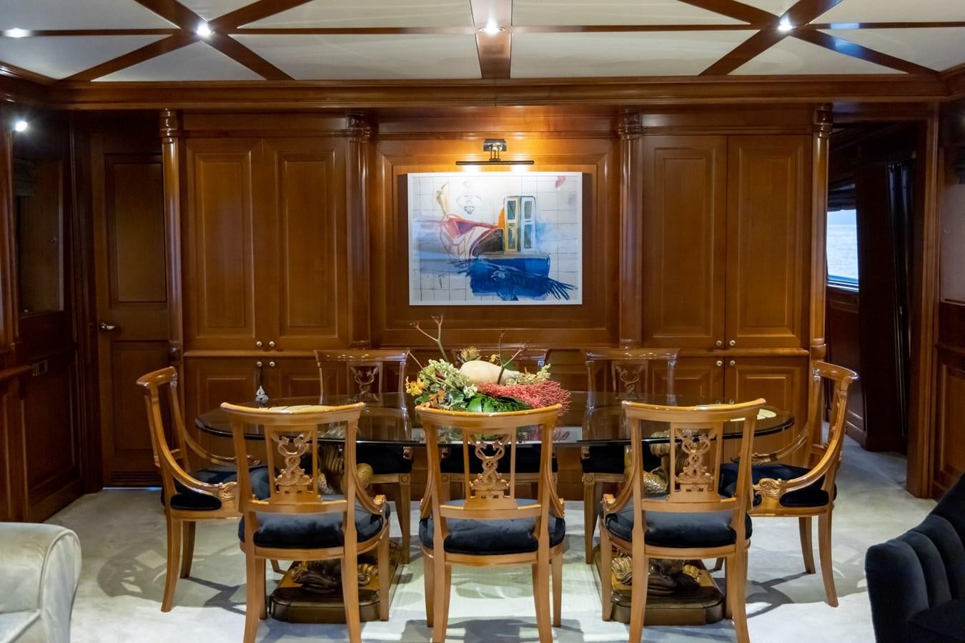 a room with chairs and a table aboard AQUILLA Yacht for Sale
