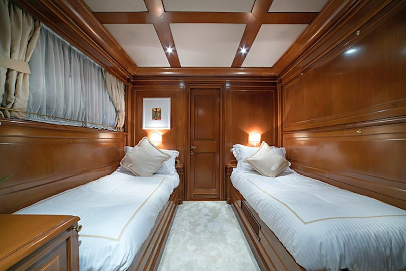 a room with two beds aboard AQUILLA Yacht for Sale
