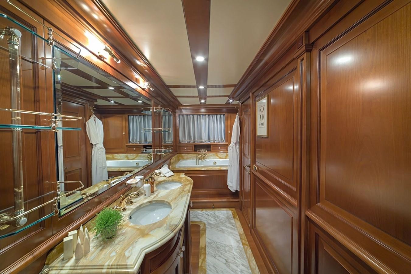 a bathroom with a large mirror aboard AQUILLA Yacht for Sale