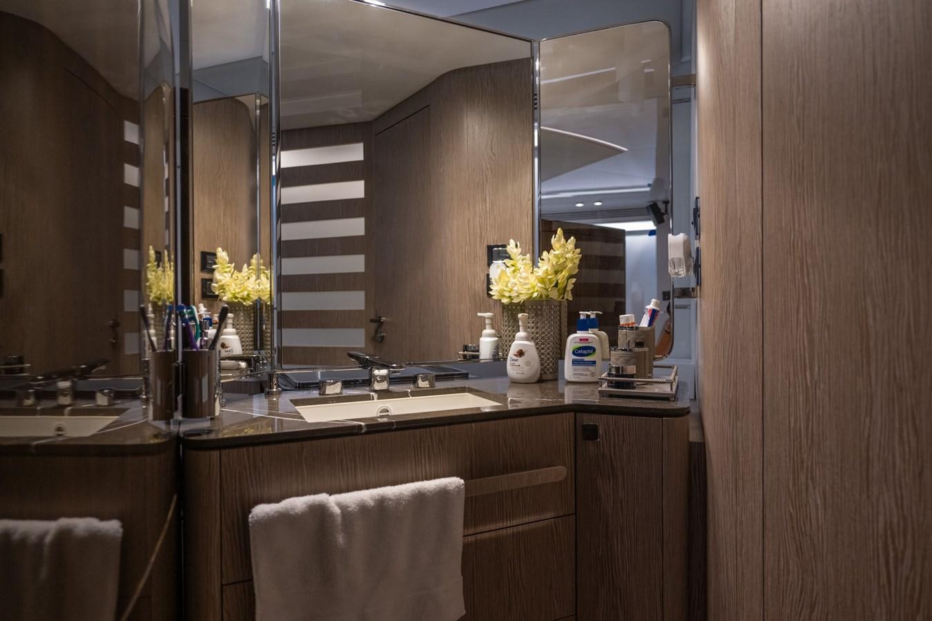 a bathroom with a large mirror aboard CANDELARIA Yacht for Sale