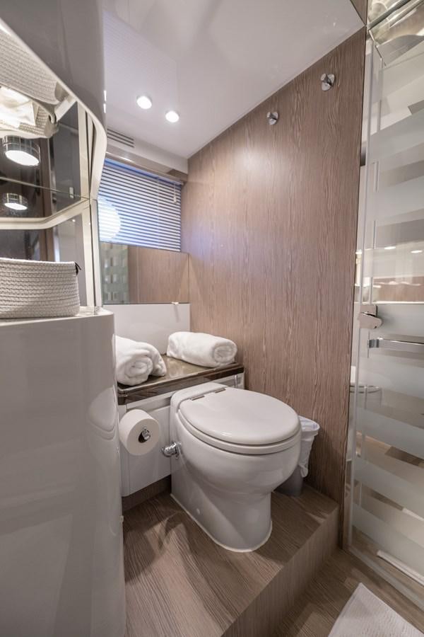 a bathroom with a toilet and a sink aboard CANDELARIA Yacht for Sale