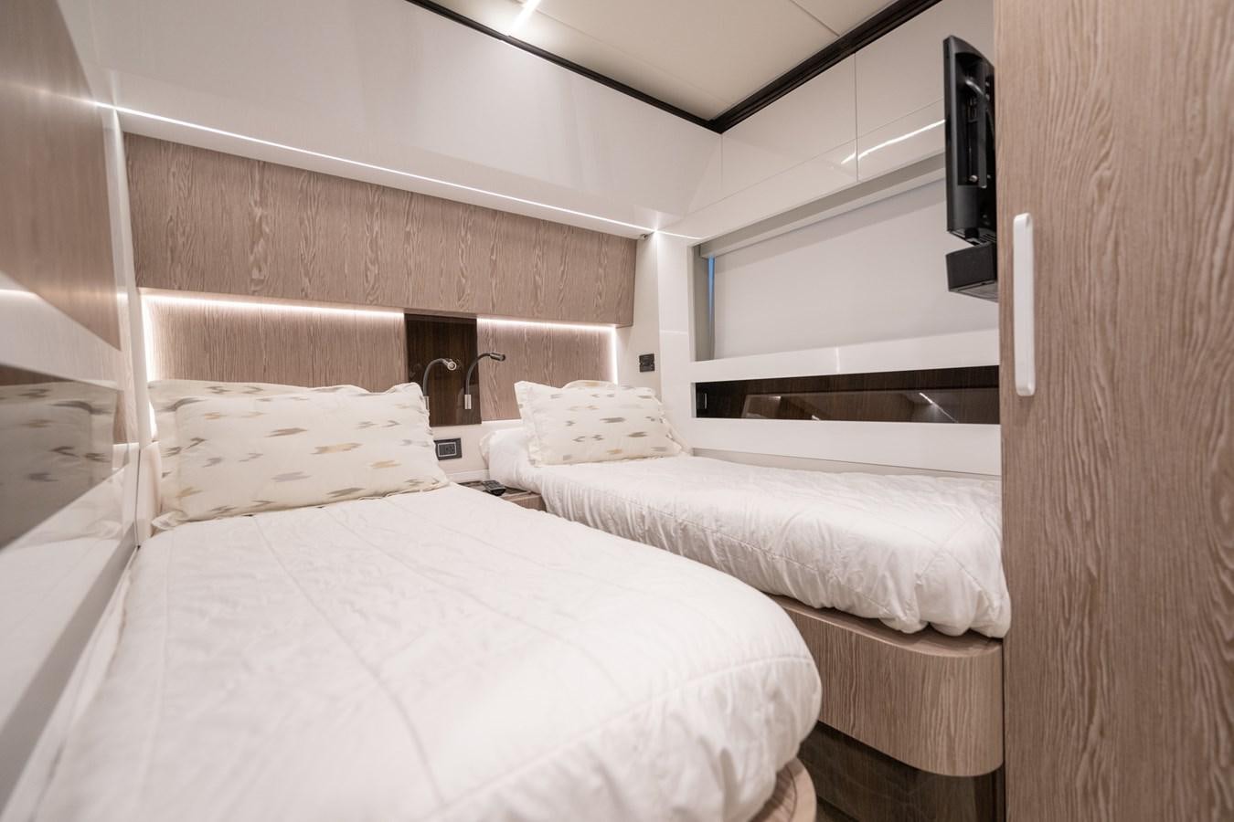 a room with two beds aboard CANDELARIA Yacht for Sale