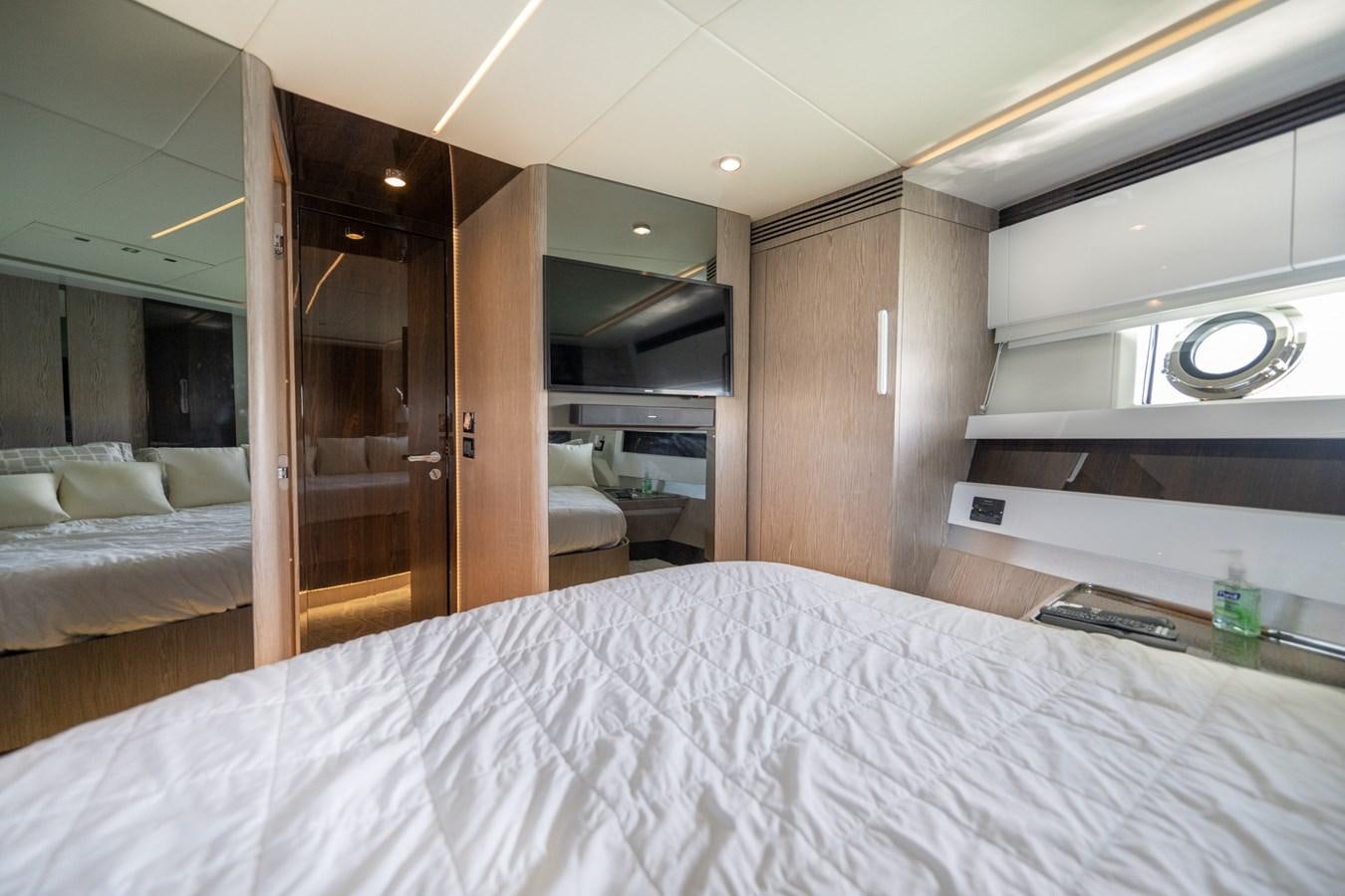 a room with a bed and a desk aboard CANDELARIA Yacht for Sale