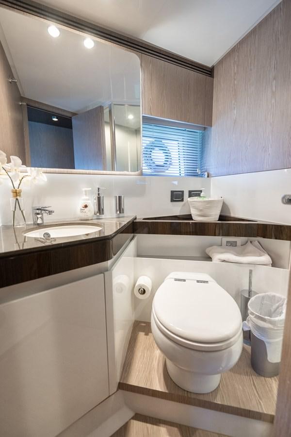 a bathroom with a large mirror aboard CANDELARIA Yacht for Sale