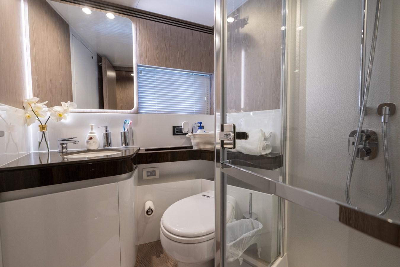 a bathroom with a glass shower aboard CANDELARIA Yacht for Sale