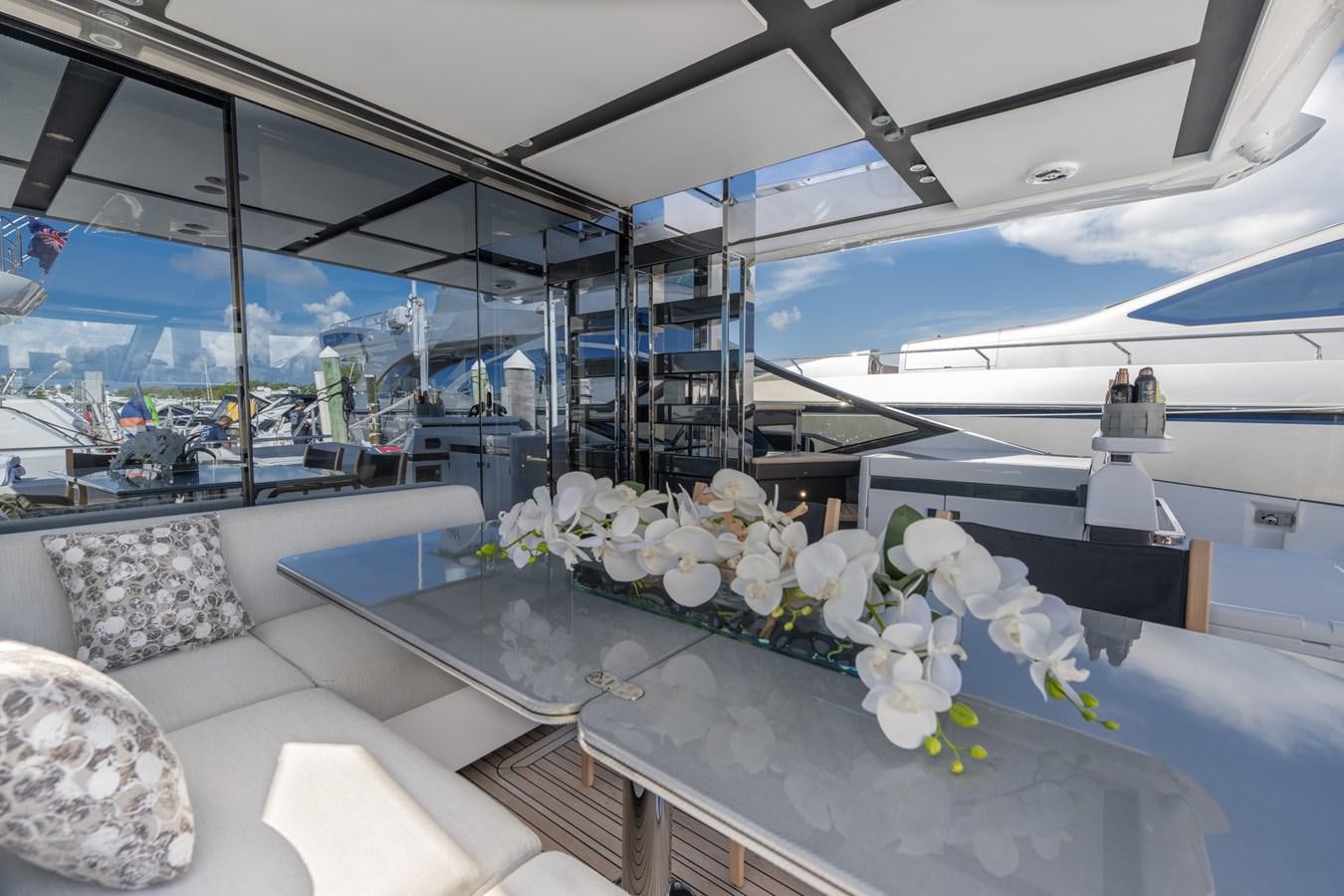 a room with a table and chairs aboard CANDELARIA Yacht for Sale