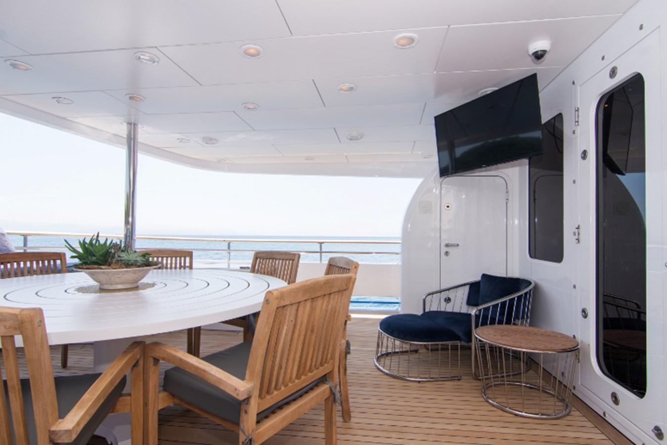 a room with a table and chairs aboard 4*PUPPIES Yacht for Sale