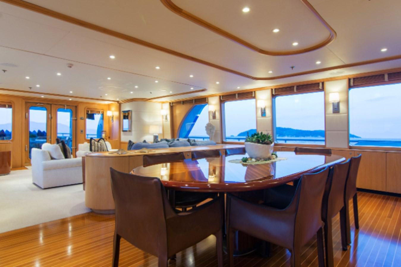 a large dining room with a large table and chairs aboard 4*PUPPIES Yacht for Sale