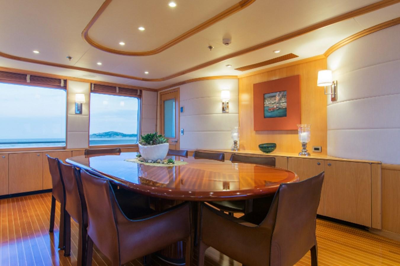 a dining room with a table and chairs aboard 4*PUPPIES Yacht for Sale