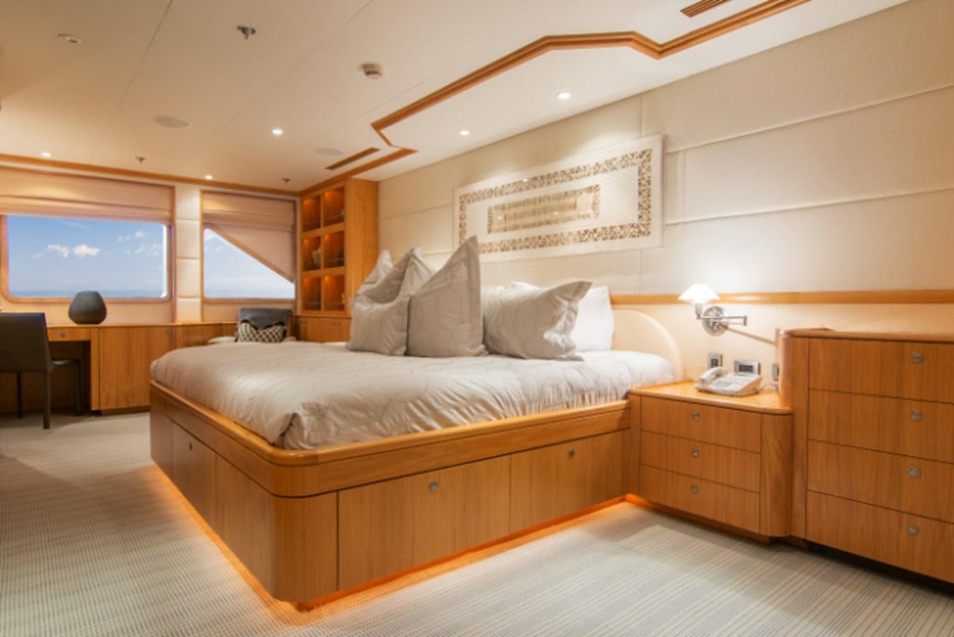a bed in a room aboard 4*PUPPIES Yacht for Sale