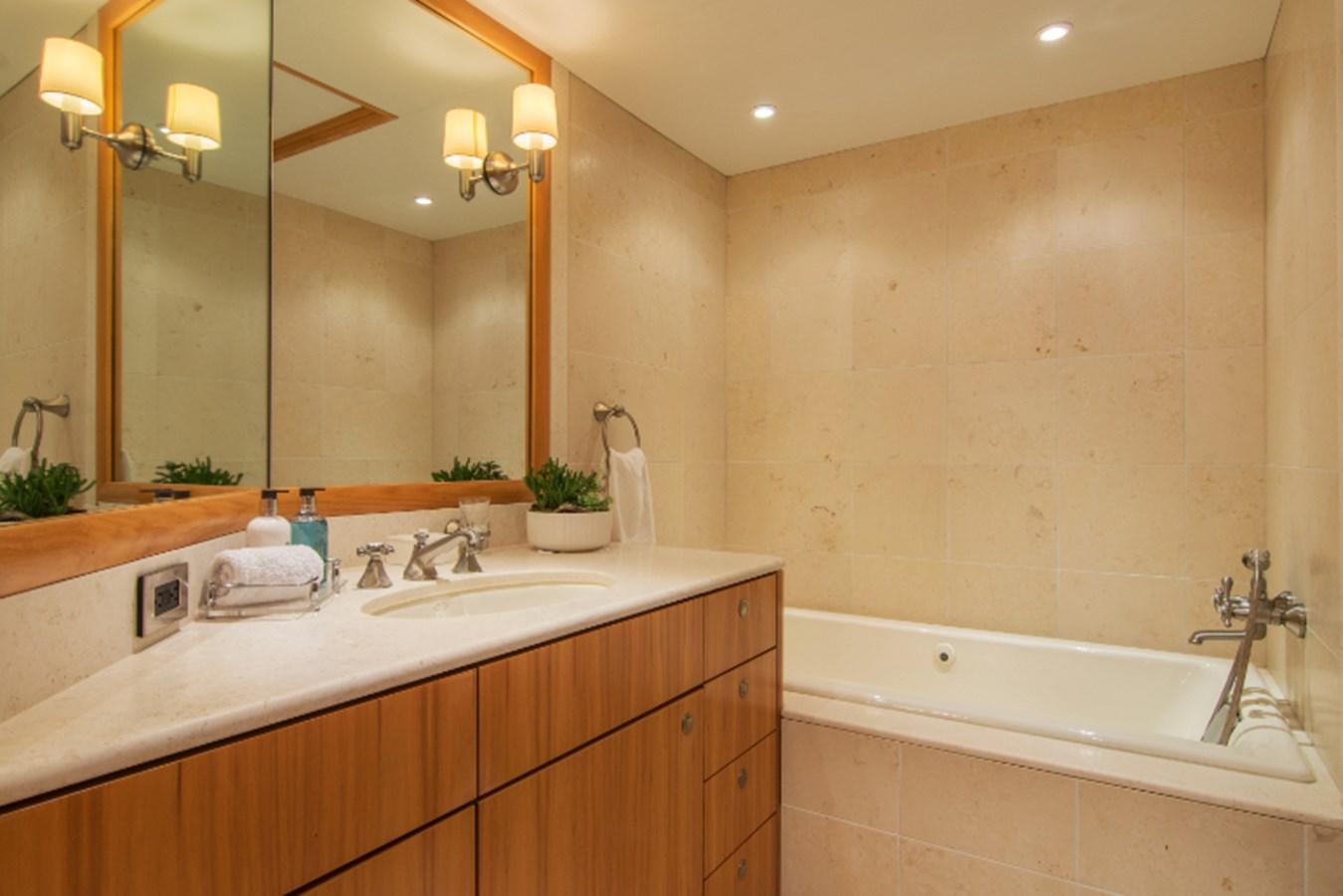 a bathroom with a large mirror aboard 4*PUPPIES Yacht for Sale