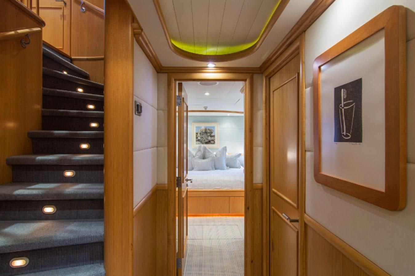 a room with a bed and a door aboard 4*PUPPIES Yacht for Sale