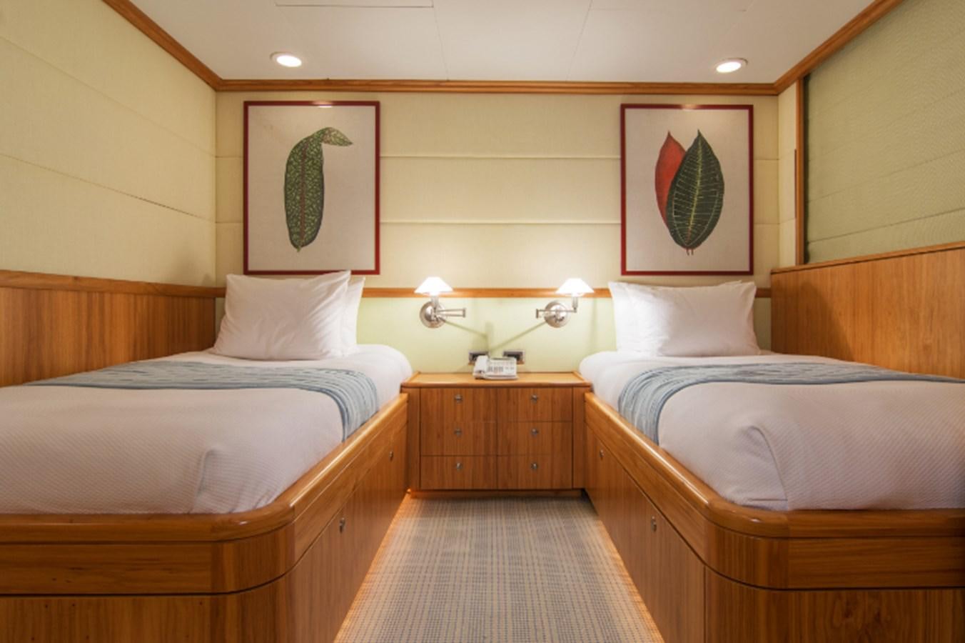 a couple of beds in a hotel room aboard 4*PUPPIES Yacht for Sale