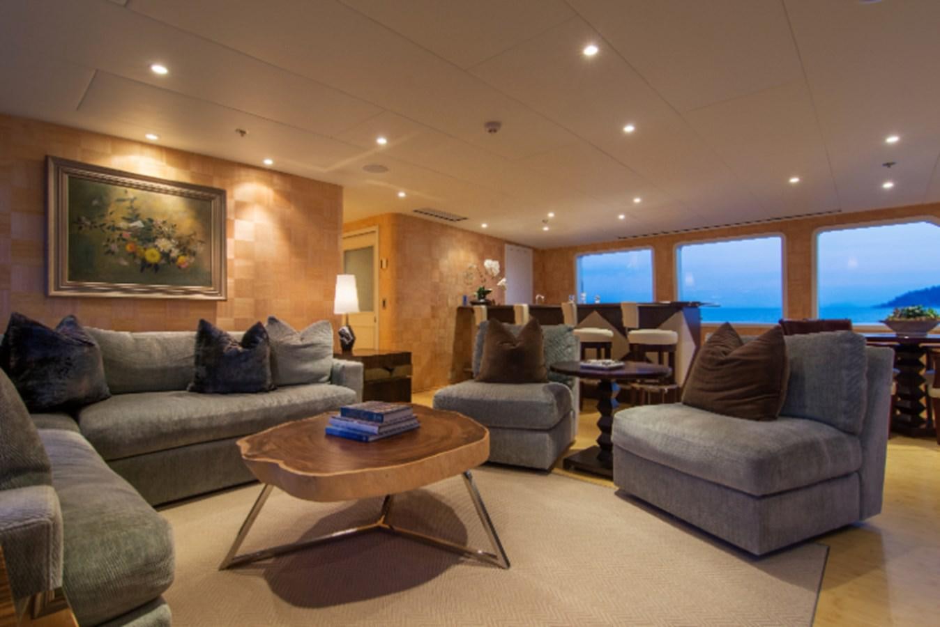 a living room with a large window aboard 4*PUPPIES Yacht for Sale