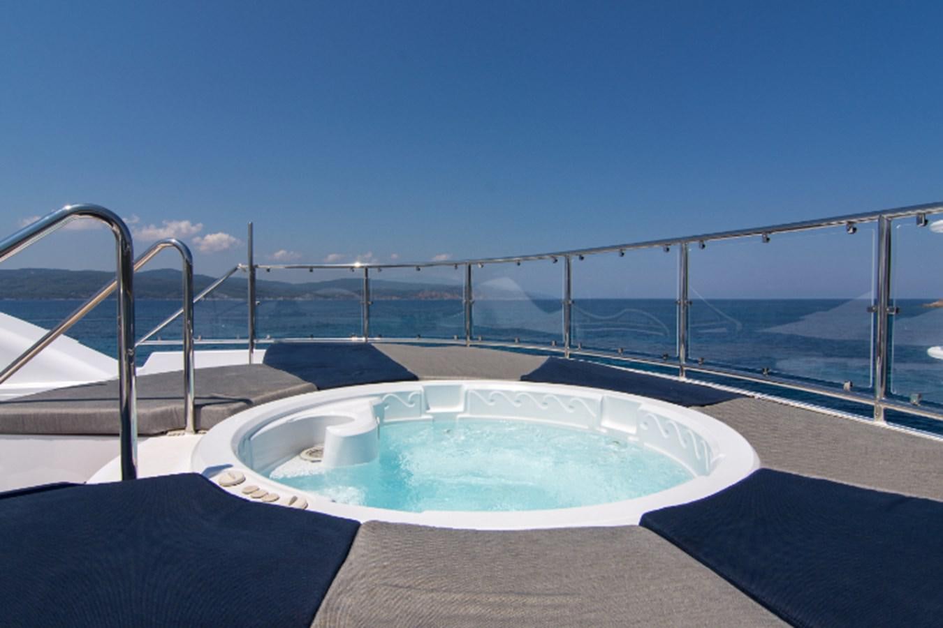 a pool on a balcony aboard 4*PUPPIES Yacht for Sale