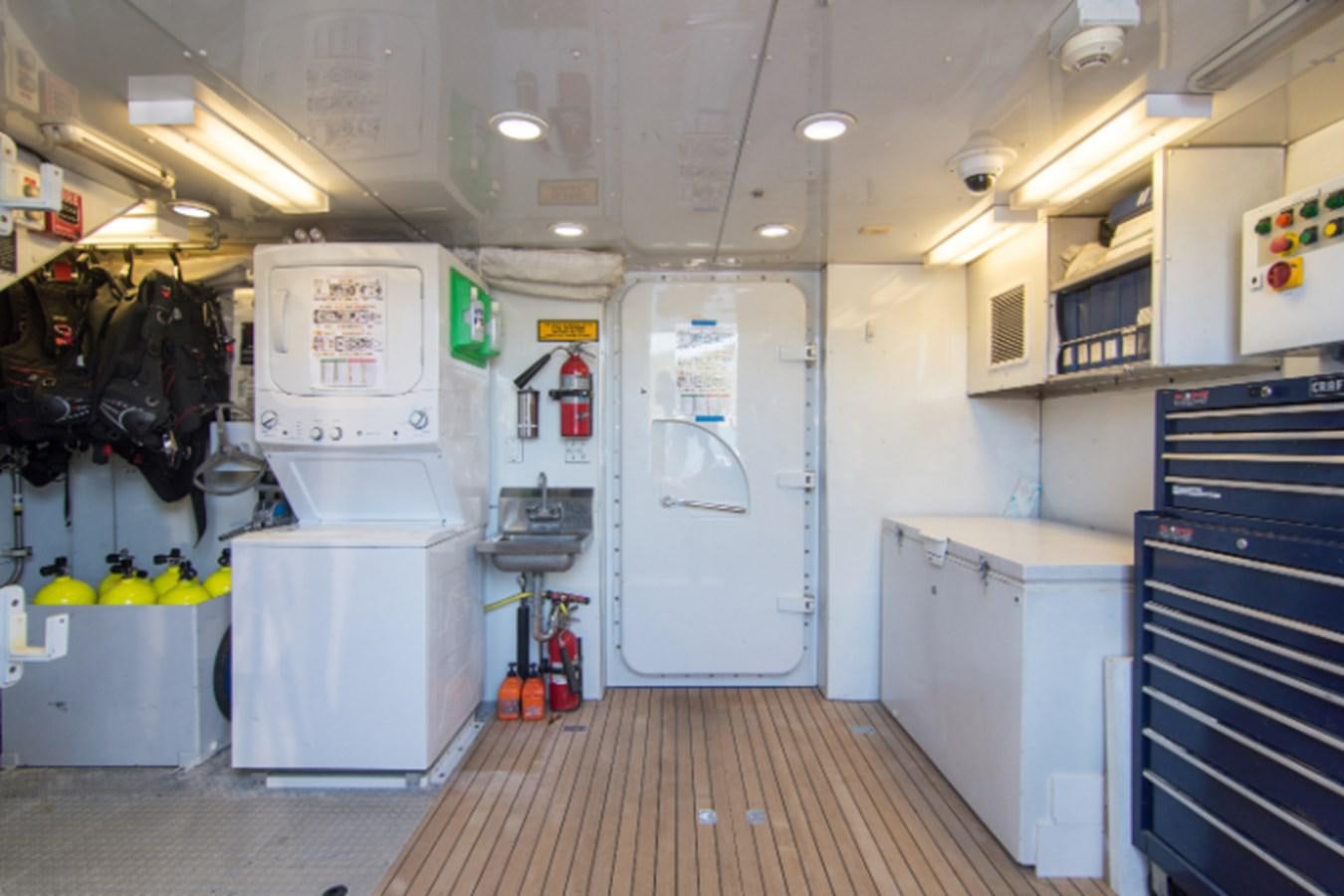 a large kitchen with white appliances aboard 4*PUPPIES Yacht for Sale
