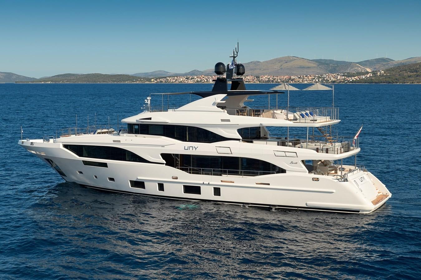 a white yacht in the water aboard UNY Yacht for Sale