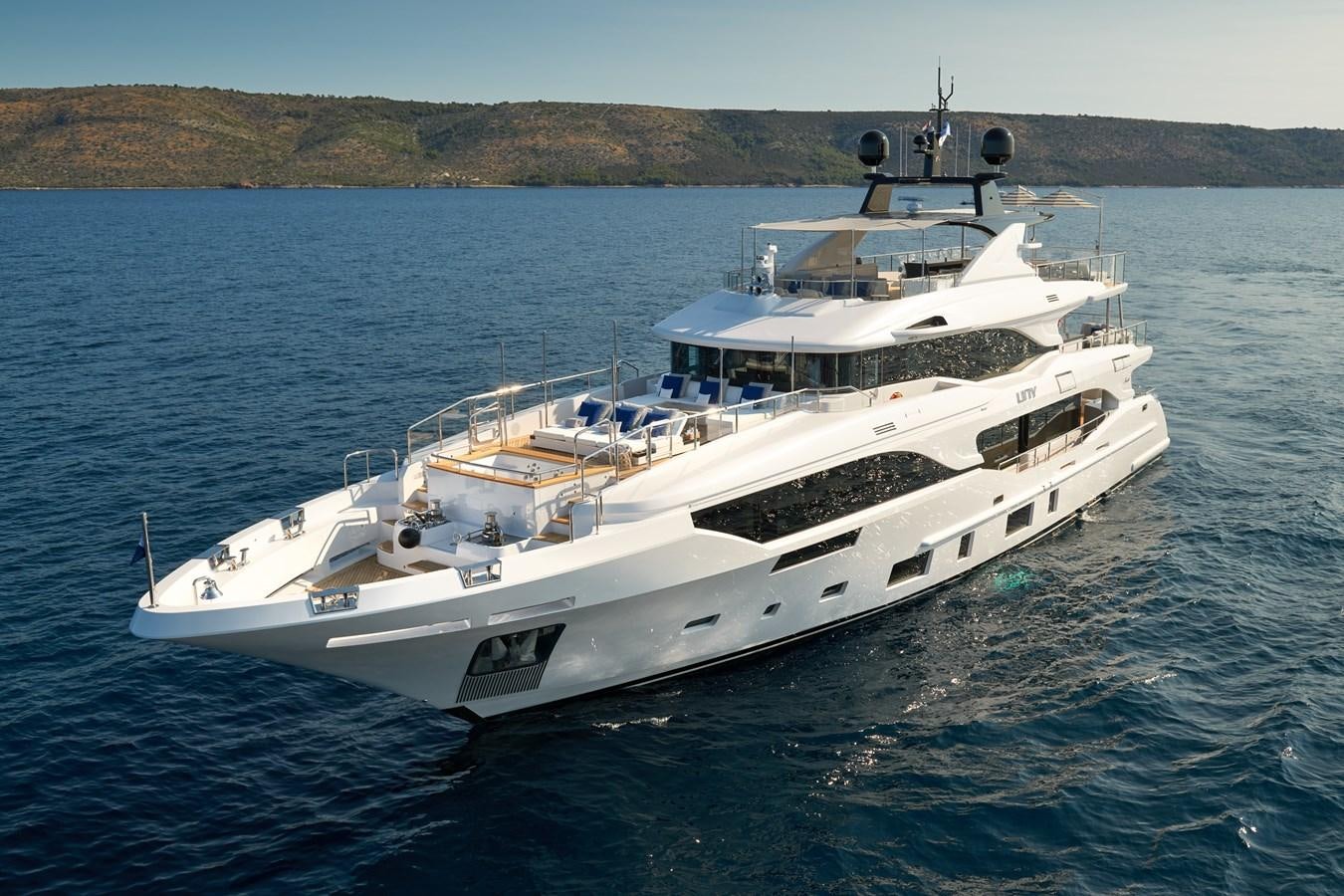 a large white boat in the water aboard UNY Yacht for Sale