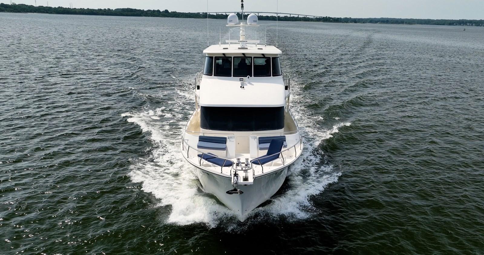 a boat on the water aboard THREE OF A KIND Yacht for Sale