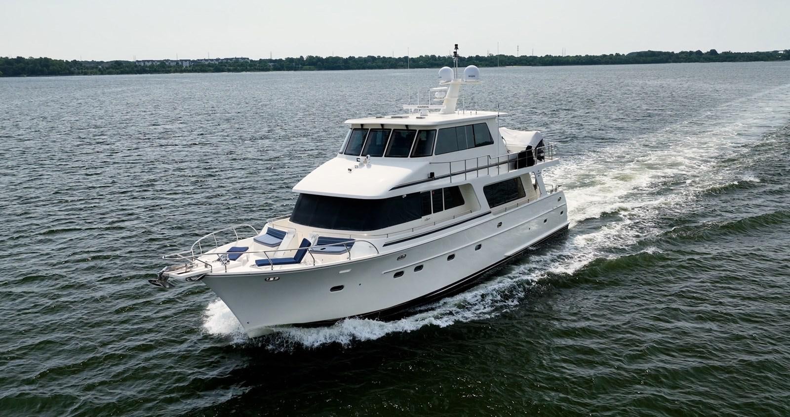 a boat on the water aboard THREE OF A KIND Yacht for Sale