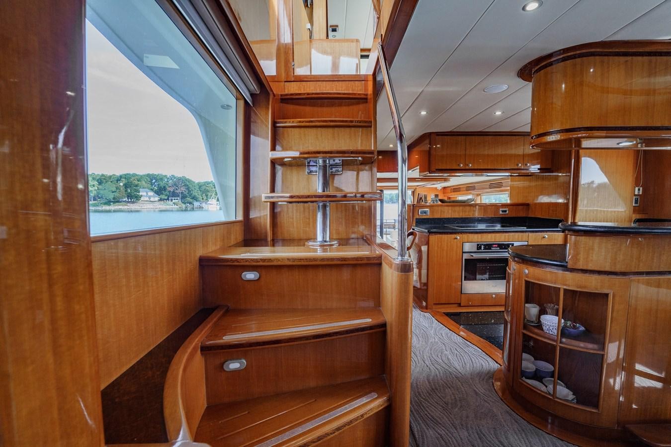 a cabin with wood furniture aboard THREE OF A KIND Yacht for Sale