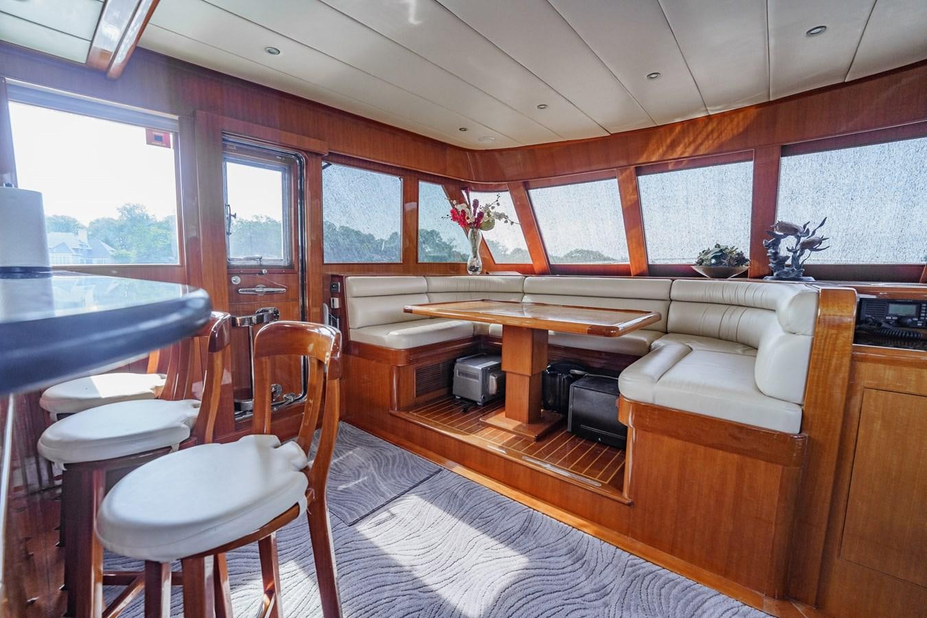 a room with a desk and a couch aboard THREE OF A KIND Yacht for Sale