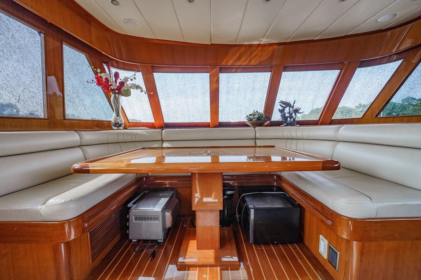 a room with a desk and a chair aboard THREE OF A KIND Yacht for Sale