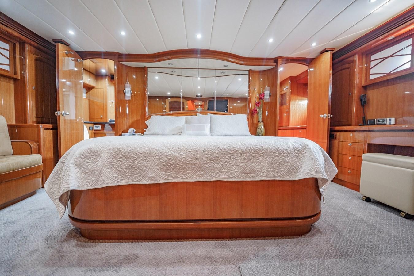 a bed in a room aboard THREE OF A KIND Yacht for Sale
