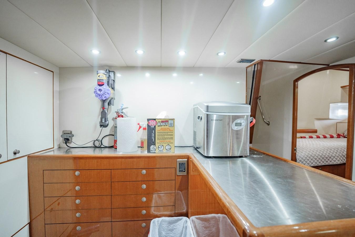 a kitchen with a sink and a microwave aboard THREE OF A KIND Yacht for Sale