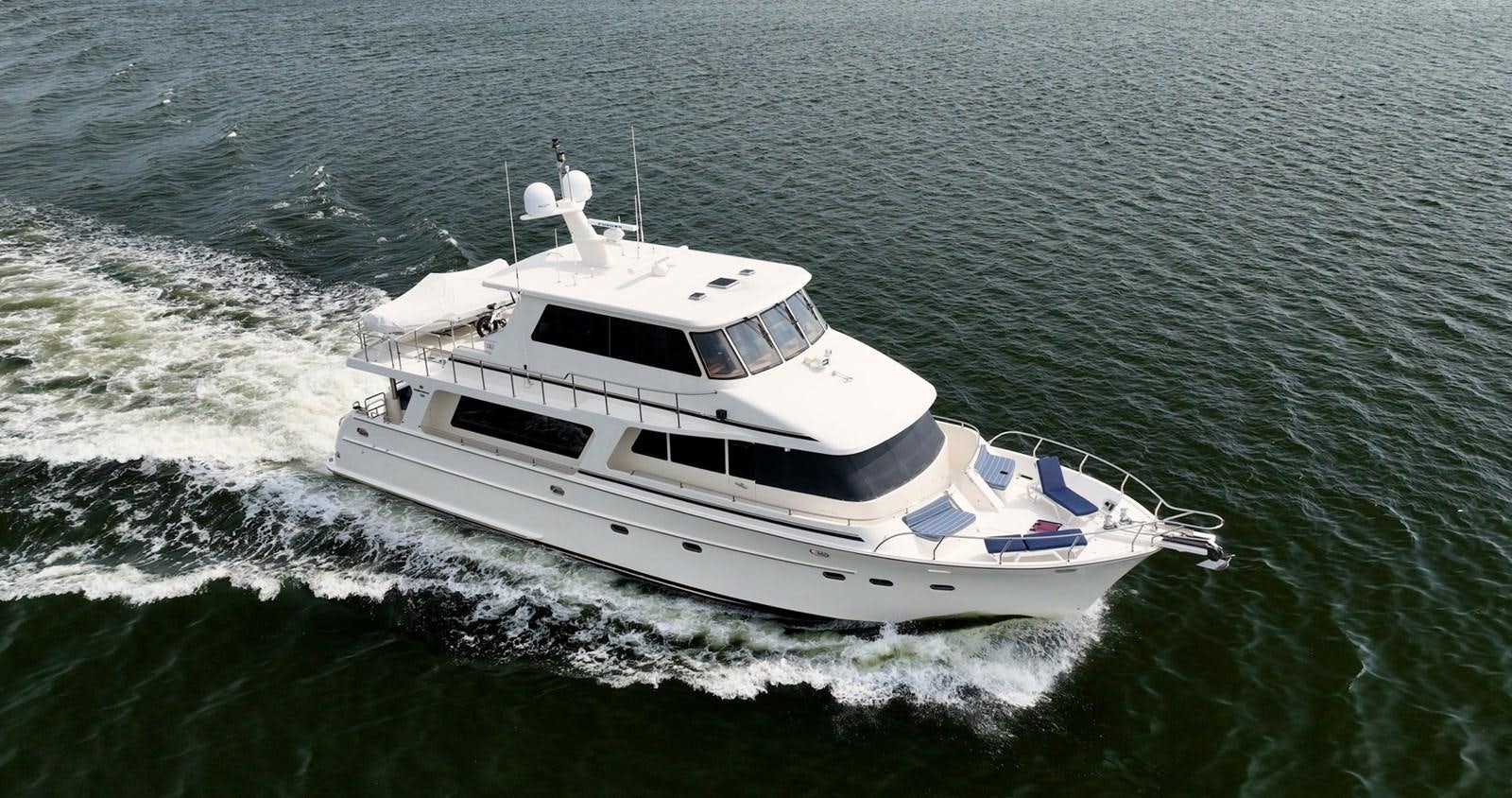 a boat in the water aboard THREE OF A KIND Yacht for Sale