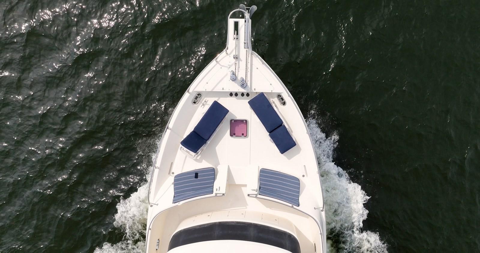 a boat in the water aboard THREE OF A KIND Yacht for Sale