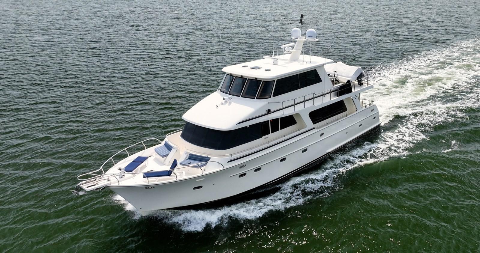 a boat on the water aboard THREE OF A KIND Yacht for Sale