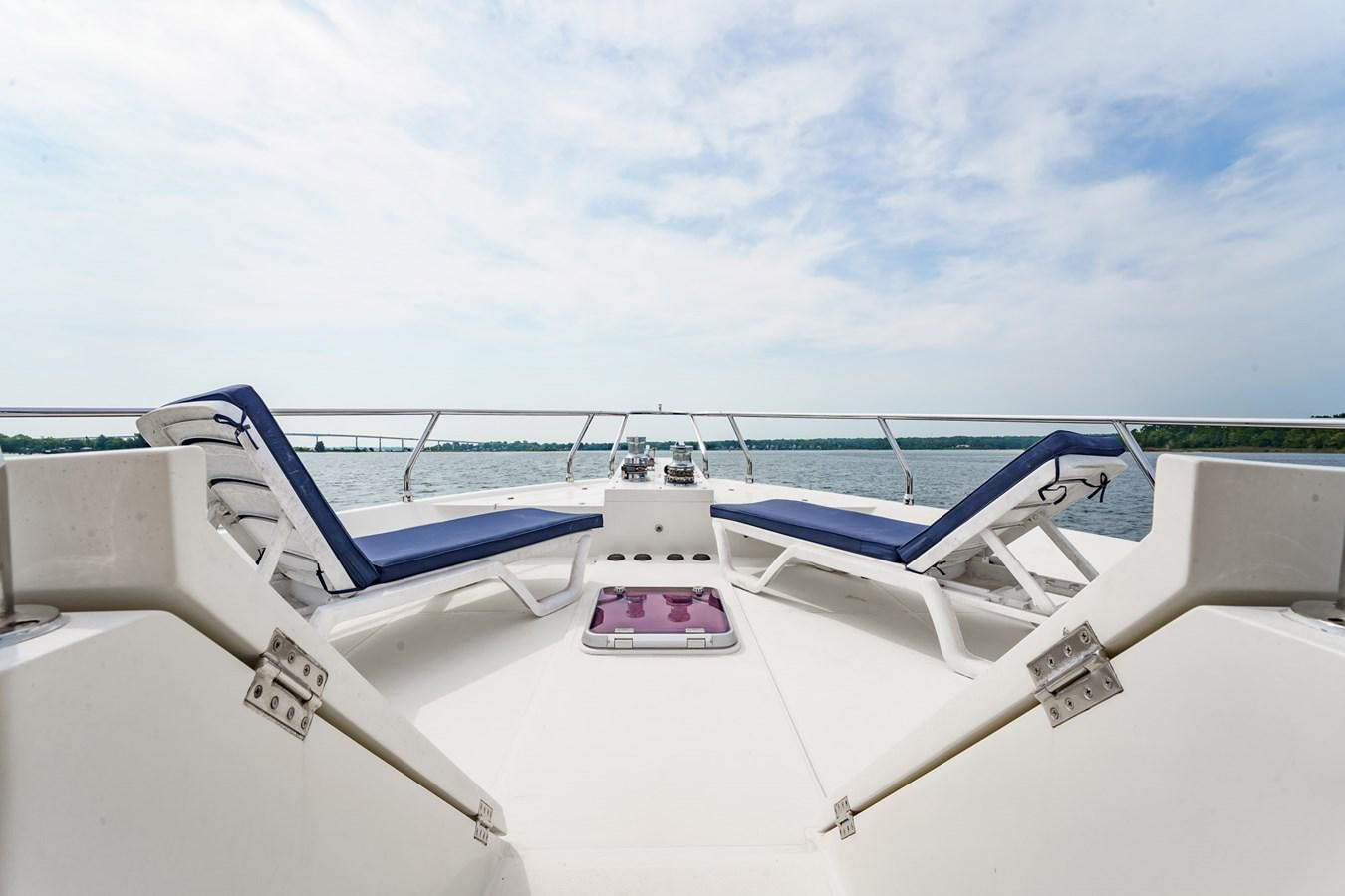 a boat on the water aboard THREE OF A KIND Yacht for Sale