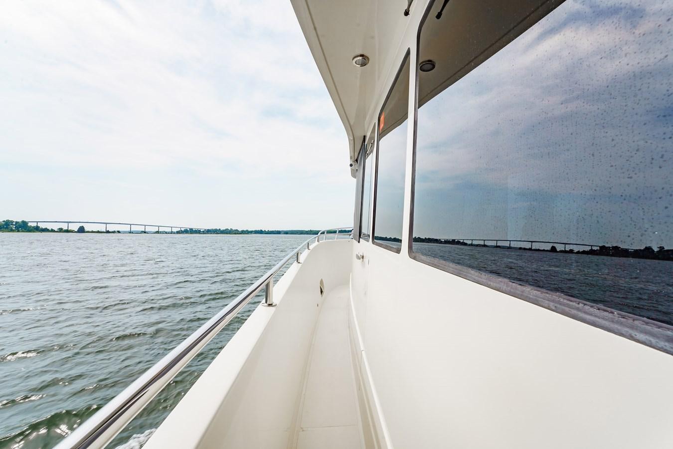 a boat on the water aboard THREE OF A KIND Yacht for Sale