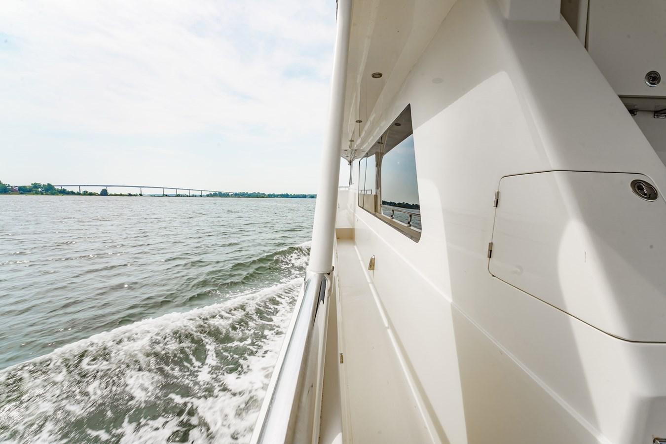 a boat on the water aboard THREE OF A KIND Yacht for Sale