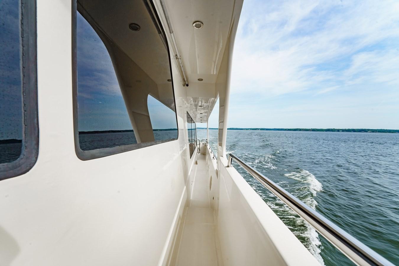 a boat on the water aboard THREE OF A KIND Yacht for Sale