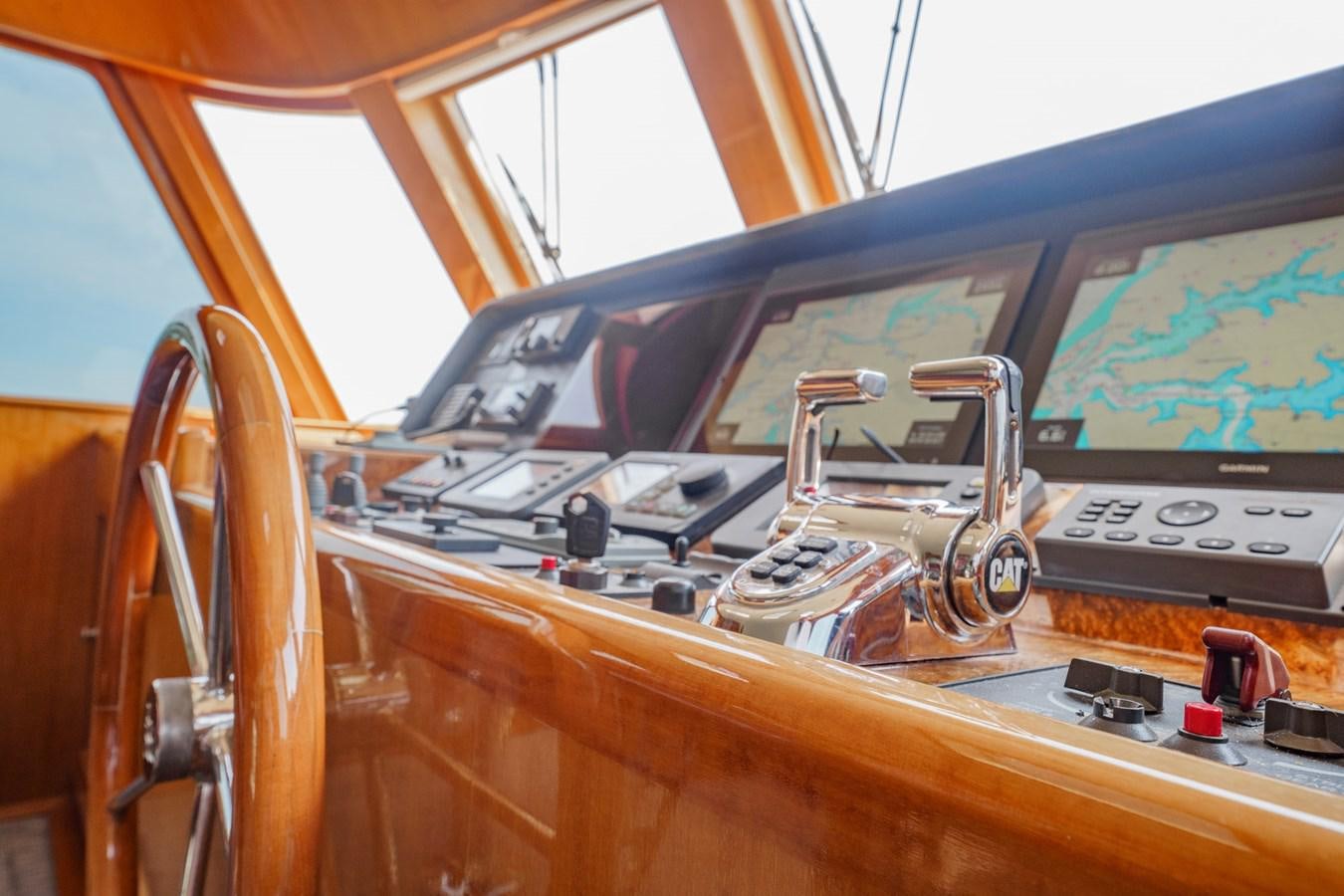 the inside of a car aboard THREE OF A KIND Yacht for Sale
