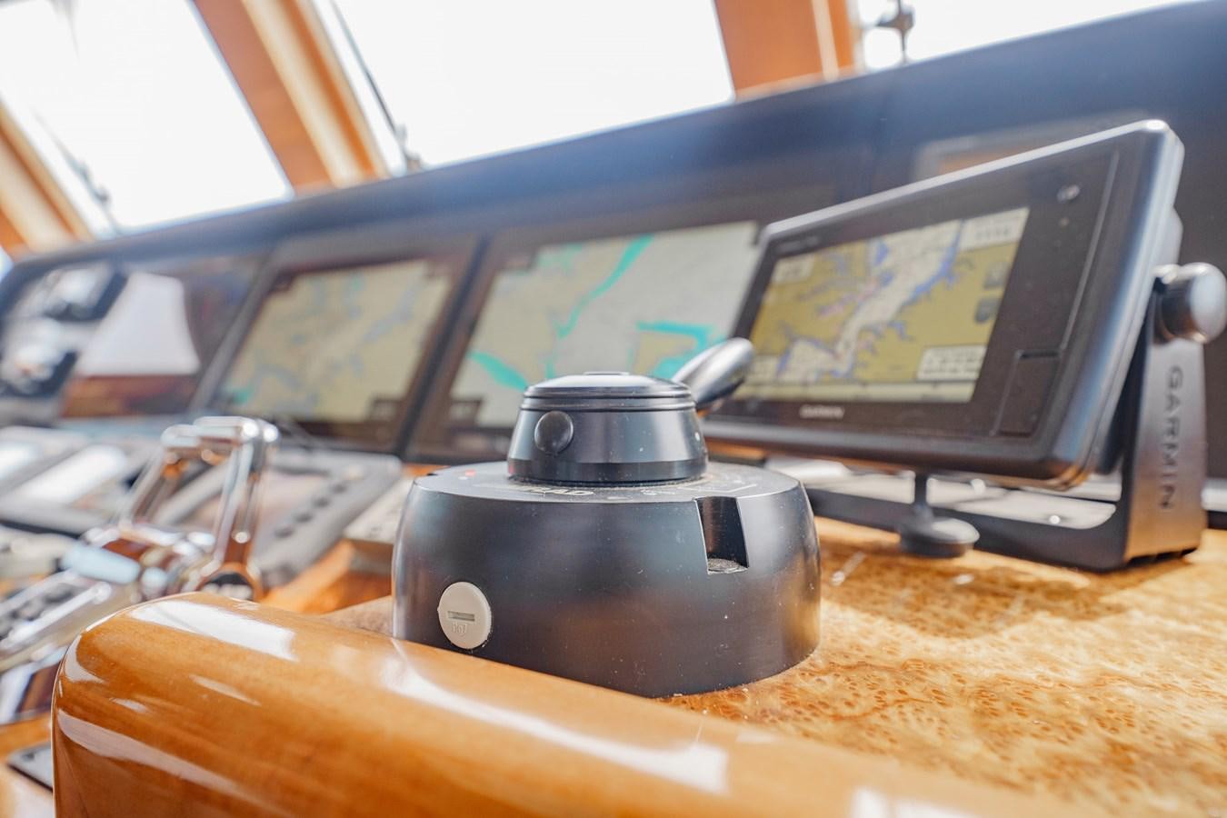 a black coffee maker on a desk aboard THREE OF A KIND Yacht for Sale